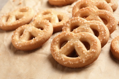 Photo of Tasty Danish butter cookies on paper background, closeup