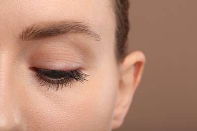 Photo of Woman with long eyelashes after mascara applying, closeup
