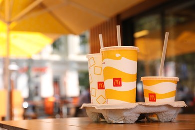 MYKOLAIV, UKRAINE - AUGUST 11, 2021: Cold McDonald's drinks on table in cafe. Space for text