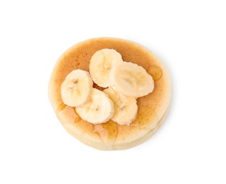 Photo of Delicious pancake with banana slices and honey isolated on white, top view