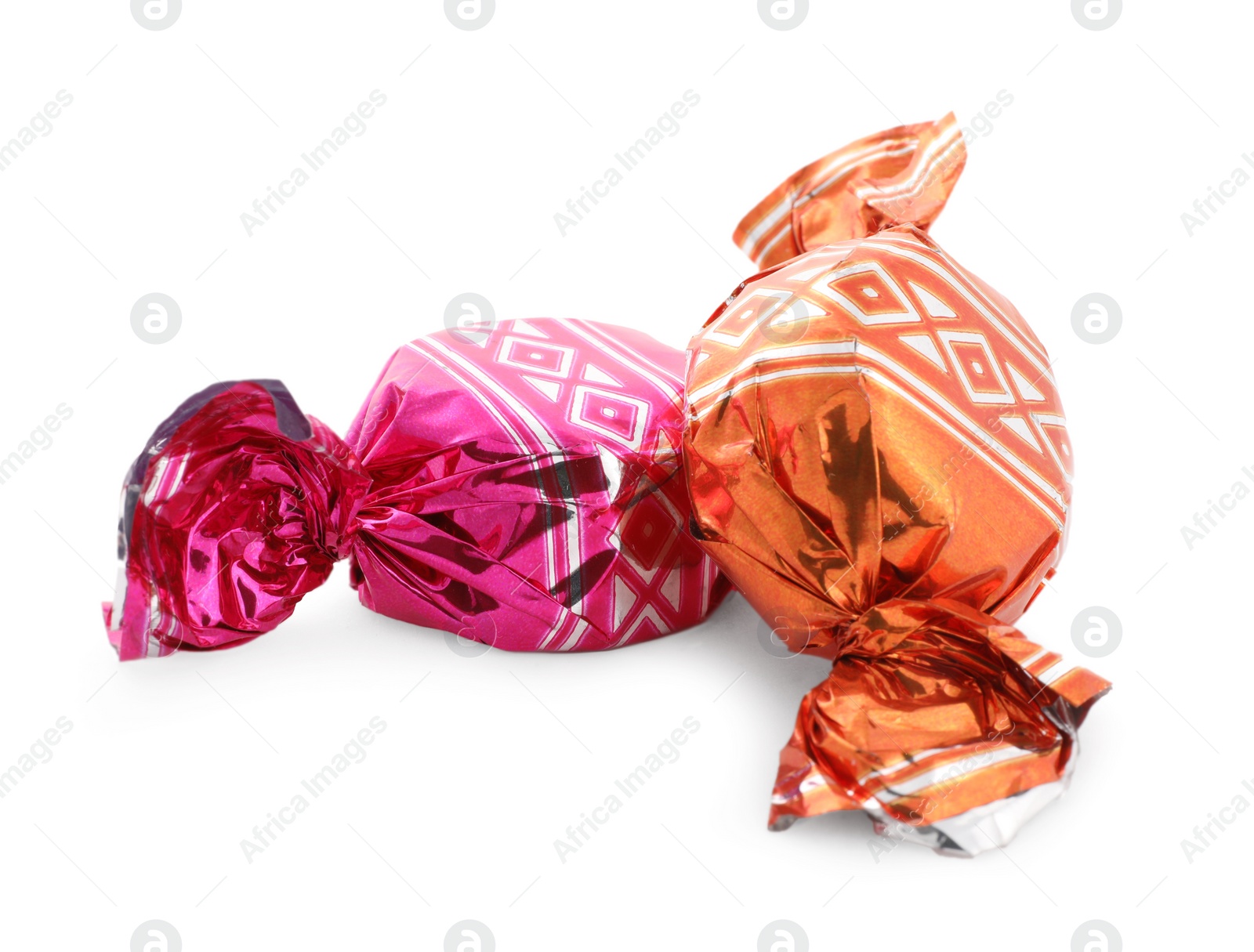 Photo of Sweet candies in colorful wrappers on white background