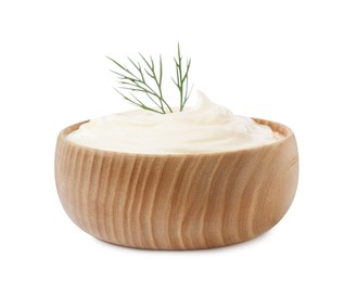 Photo of Delicious sour cream with dill in wooden bowl isolated on white