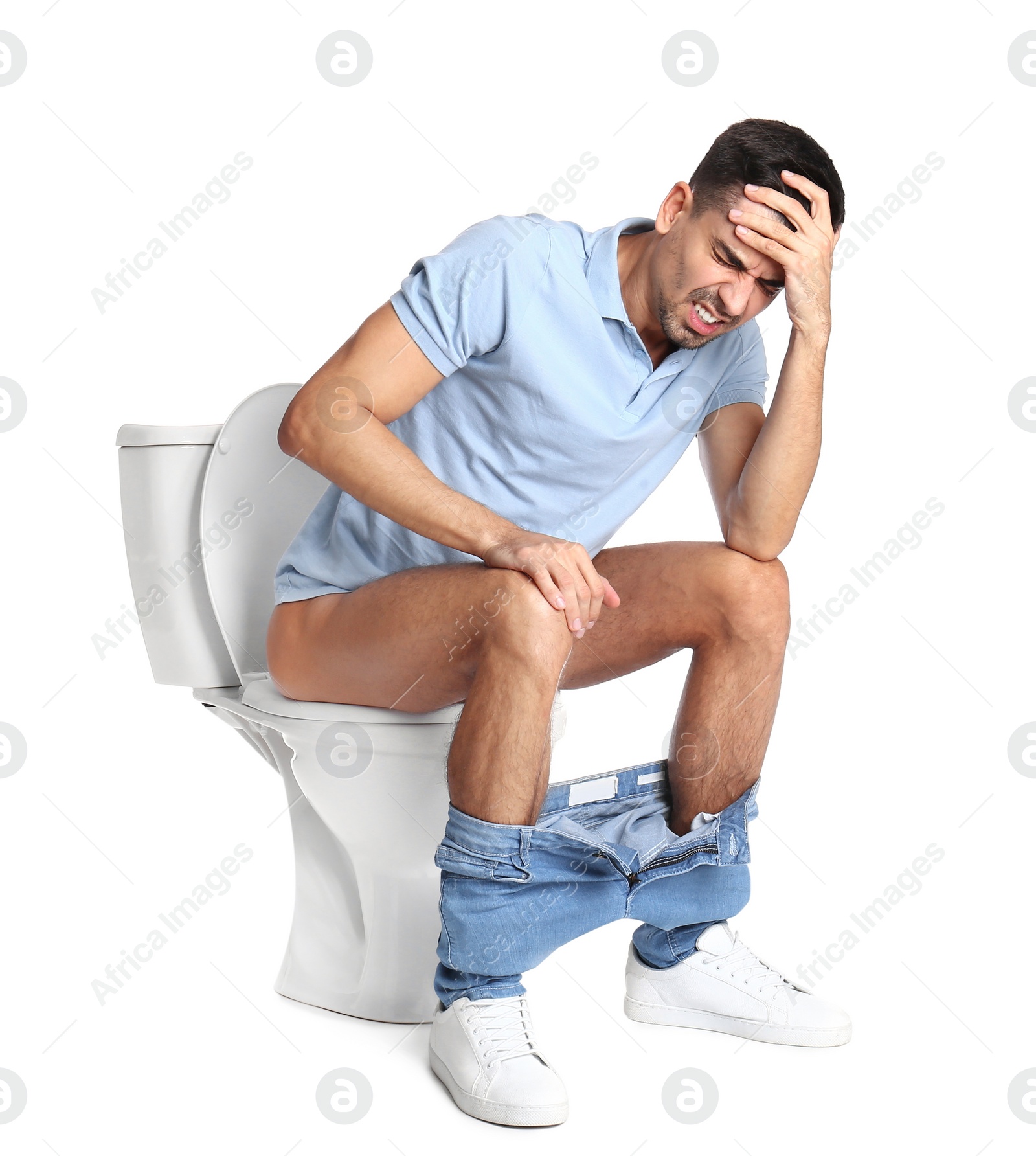 Photo of Man suffering from diarrhea on toilet bowl, white background