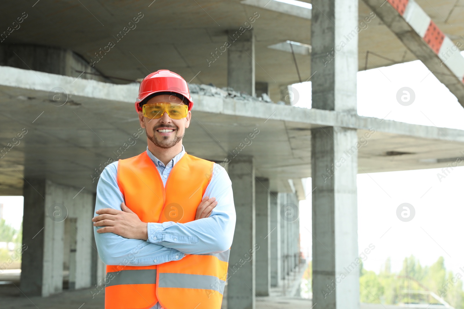 Photo of Professional engineer in safety equipment at construction site