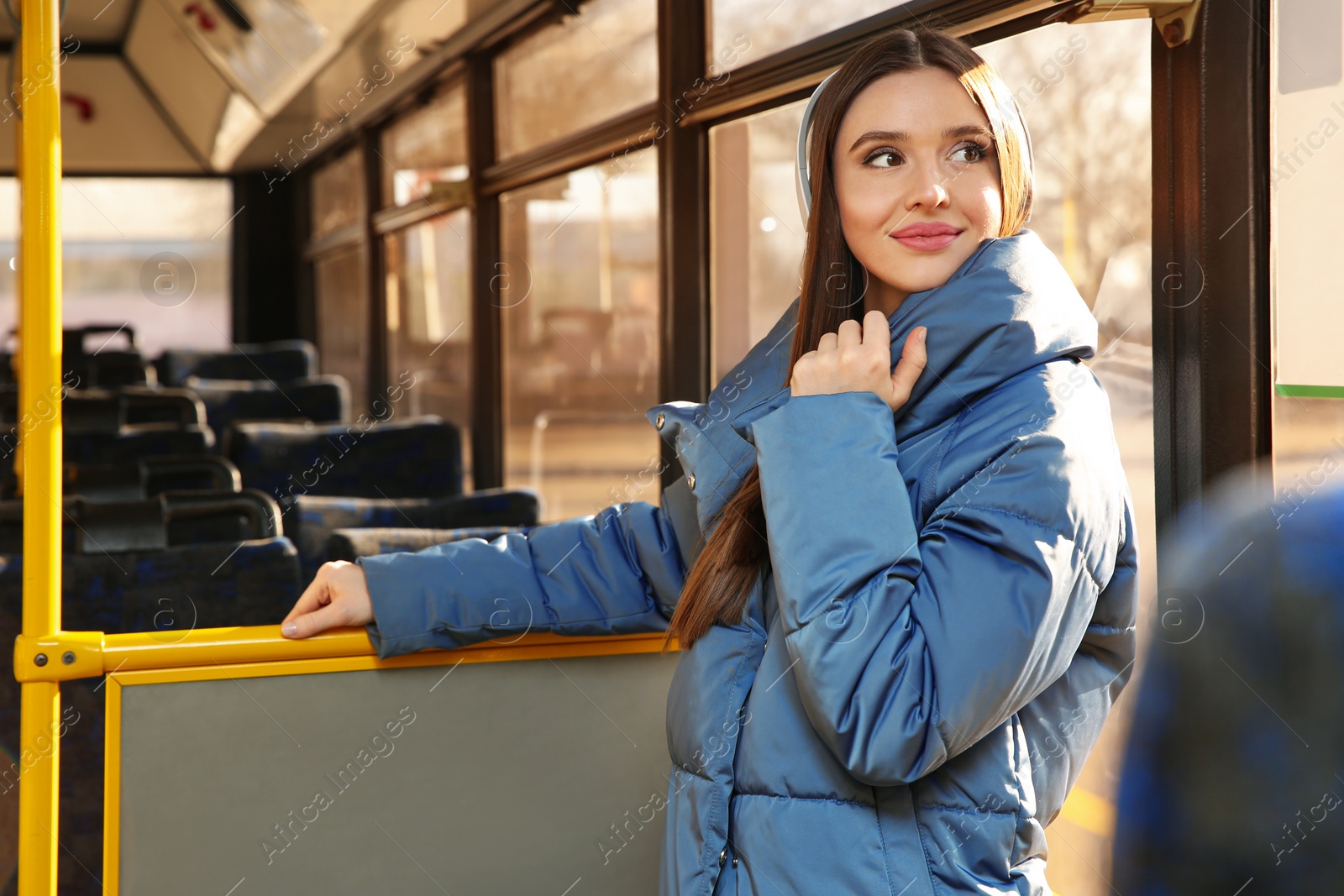 Photo of Woman listening to audiobook in trolley bus