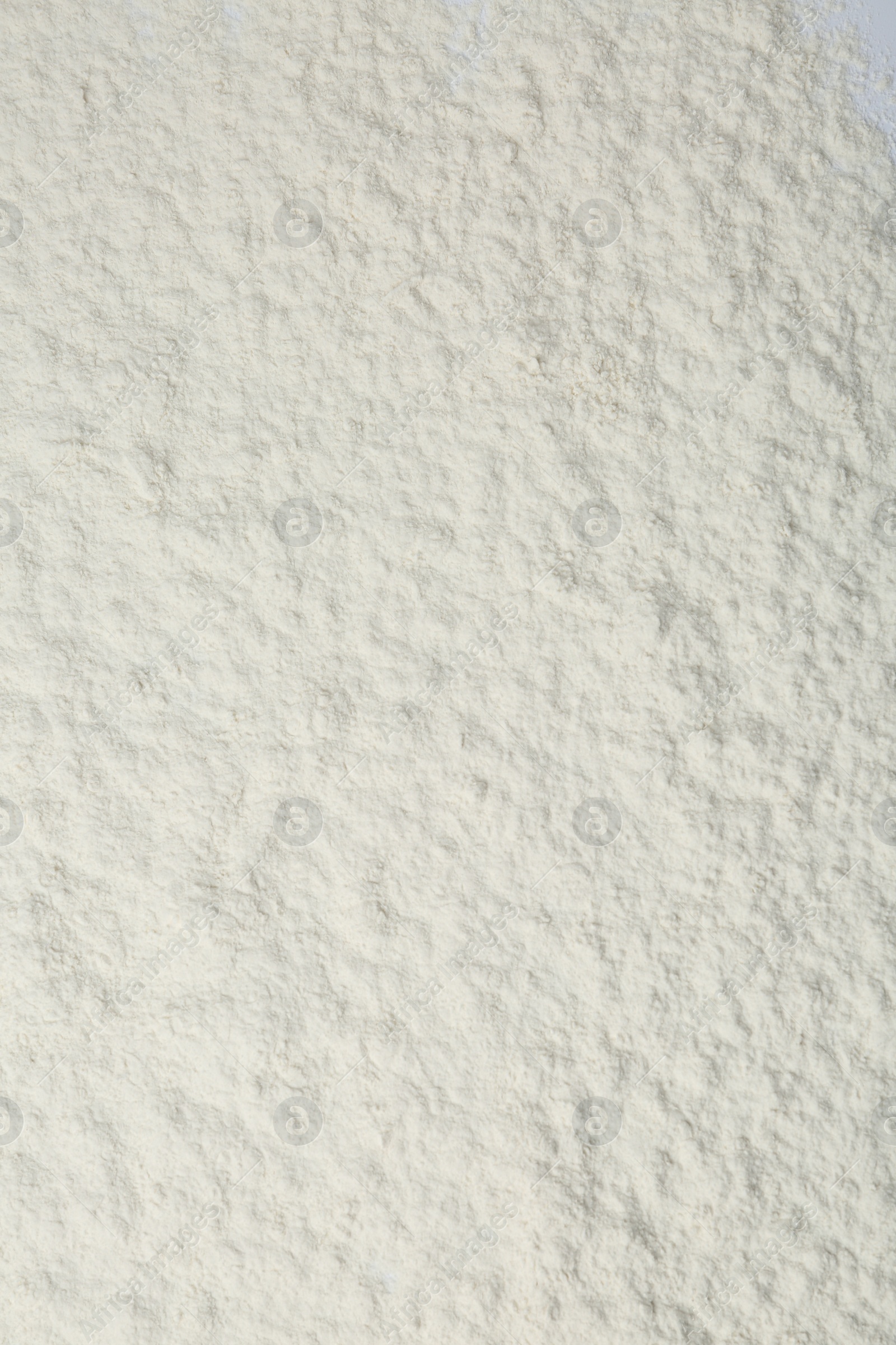 Photo of Pile of organic flour as background, top view