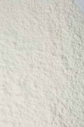 Photo of Pile of organic flour as background, top view