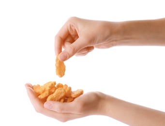 Photo of Woman holding crispy rusks on white background, closeup