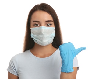 Woman in protective face mask and medical gloves on white background