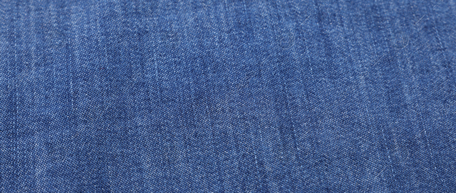 Photo of Texture of blue fabric as background, top view