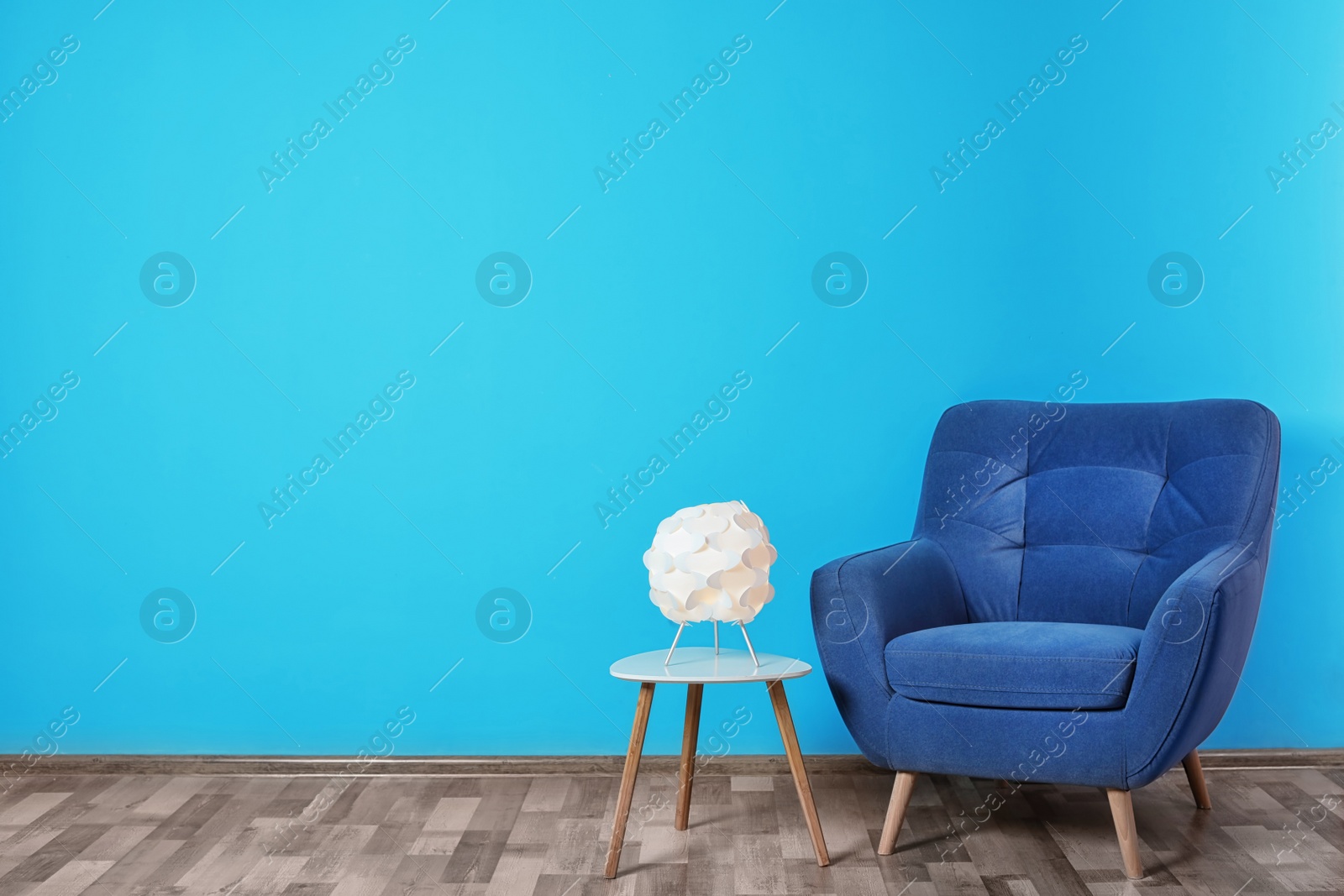 Photo of Comfortable armchair in stylish living room interior with space for text