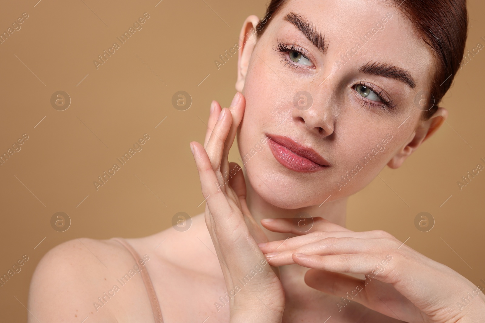 Photo of Portrait of beautiful woman on beige background, closeup