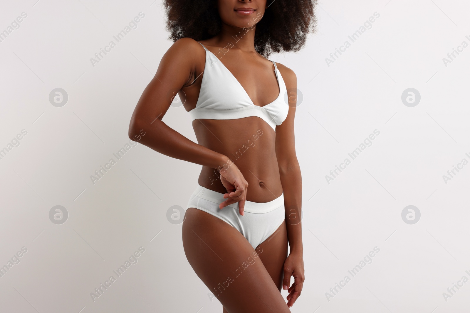 Photo of Woman in stylish bikini on white background, closeup