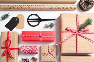 Photo of Flat lay composition with gift boxes on white background