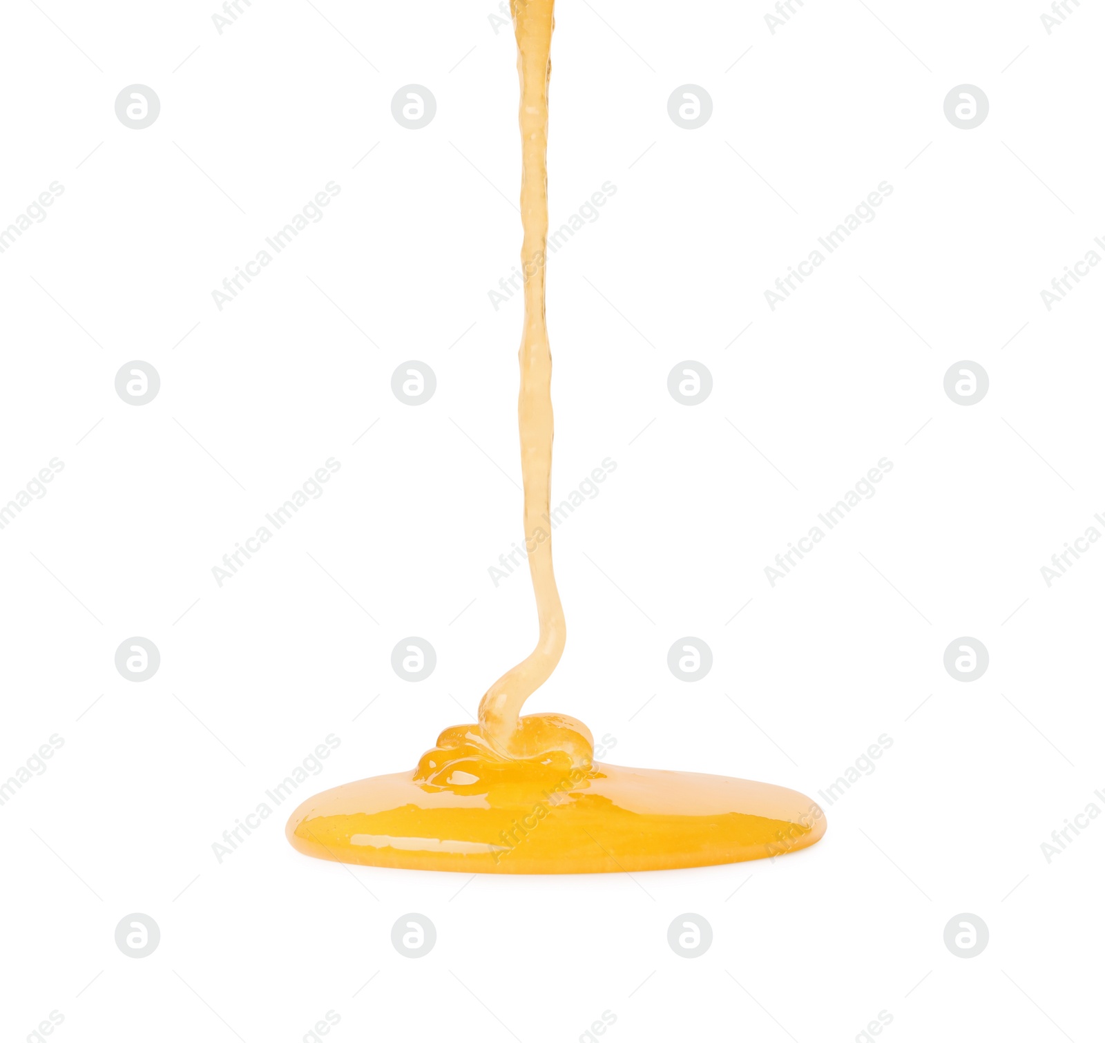 Photo of Pouring tasty natural honey isolated on white