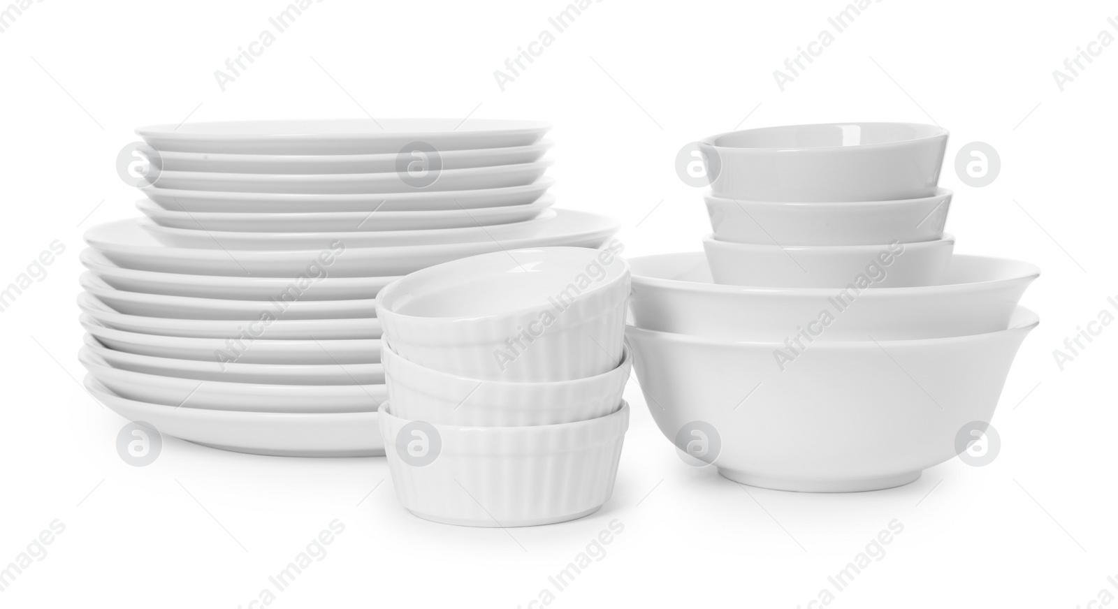 Photo of Set of clean tableware on white background. Washing dishes