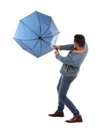 Photo of Man with umbrella caught in gust of wind on white background