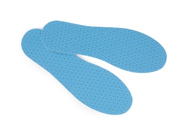 Photo of Pair of insoles on white background, top view