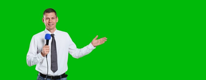 Chroma key compositing. Broadcaster with microphone against green screen, banner design