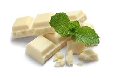 Pieces of white chocolate with mint on white background