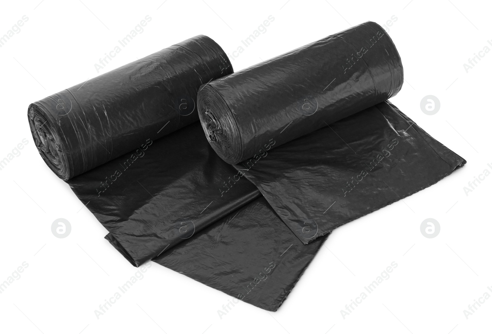 Photo of Rolls of black garbage bags isolated on white