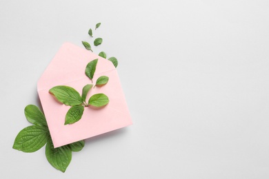 Photo of Flat lay composition with green leaves on color background. Space for text