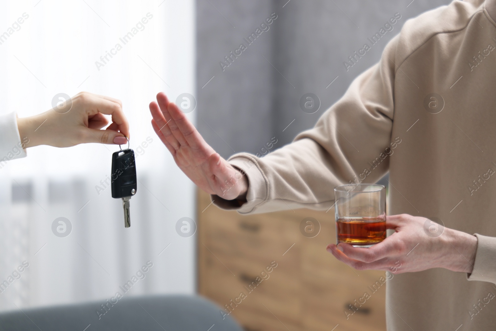 Photo of Drunk man refusing drive car while woman suggesting him keys, closeup. Don't drink and drive concept