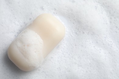 Photo of Top view of soap and fluffy foam