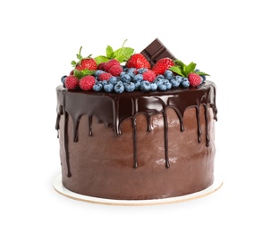 Delicious chocolate cake decorated with fresh berries on white background