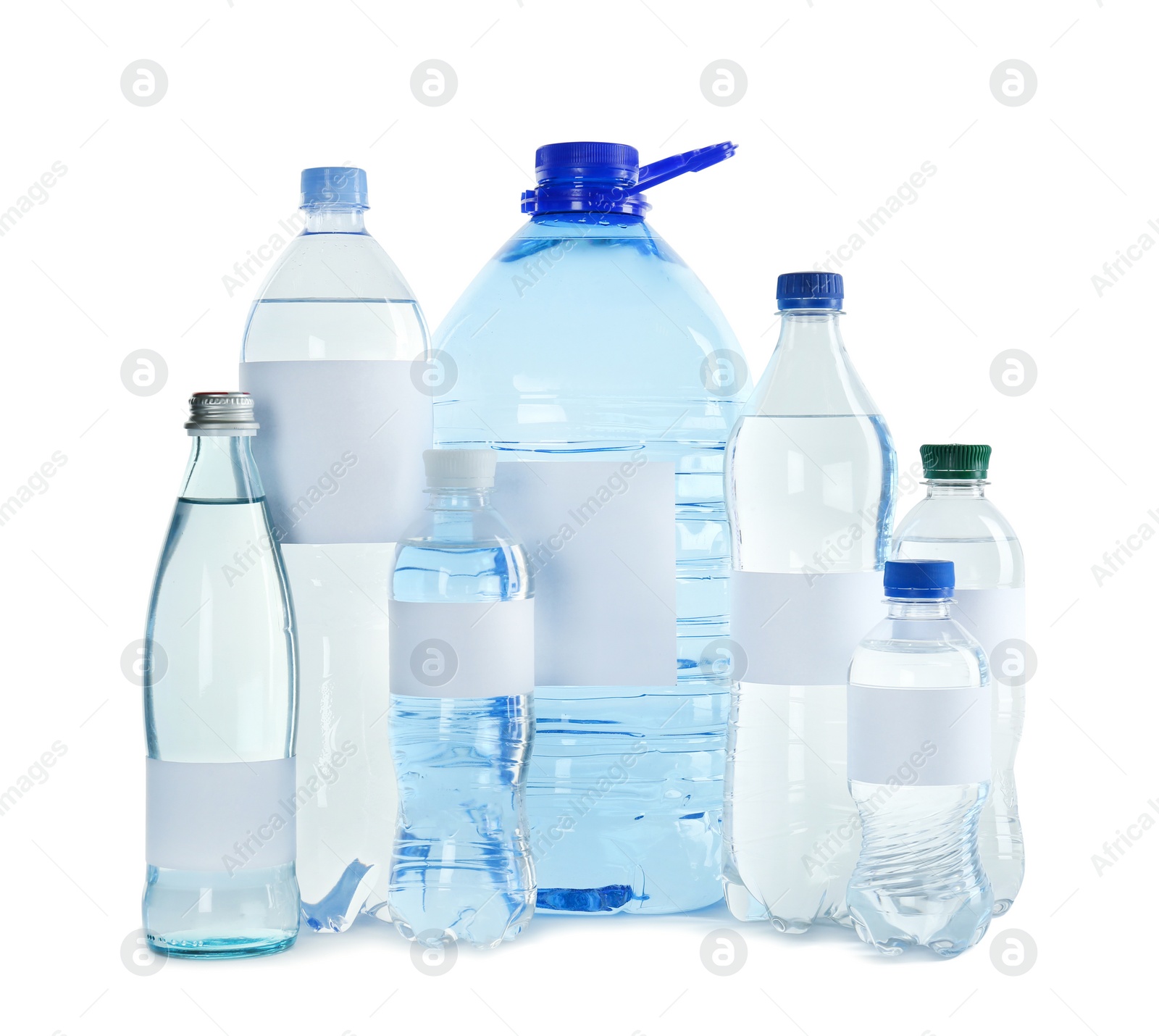 Photo of Different bottles of pure water with blank tags on white background