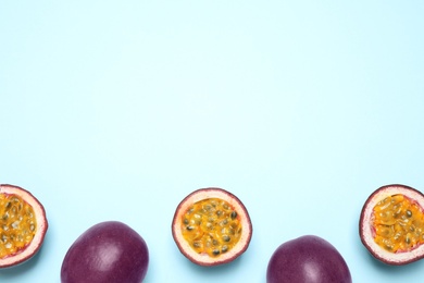 Photo of Fresh ripe passion fruits (maracuyas) on light background, flat lay. Space for text