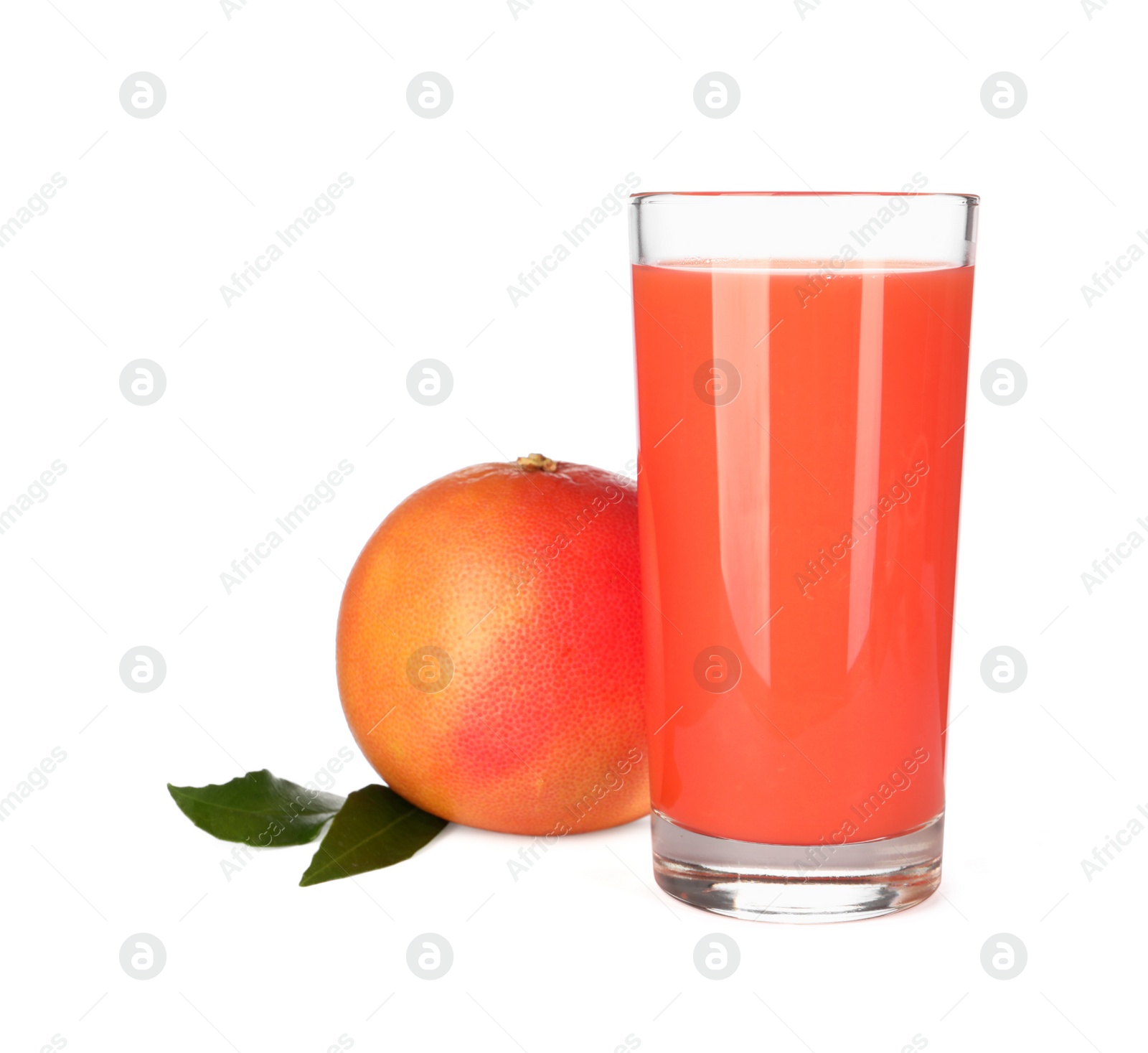 Photo of Tasty grapefruit juice in glass, leaves and fresh fruit isolated on white