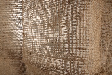 Texture of natural burlap fabric as background, closeup