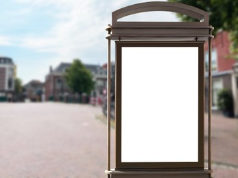 Image of Blank citylight poster on city street. Space for design