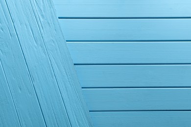 Photo of Light blue wooden surfaces as background, top view