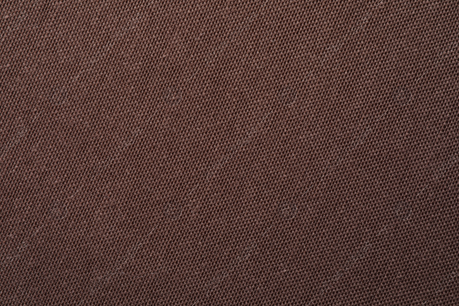 Photo of Texture of brown fabric as background, top view