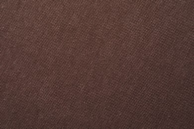 Texture of brown fabric as background, top view