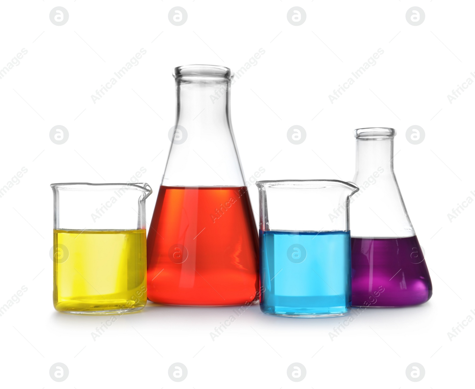 Photo of Laboratory glassware with color liquids on white background