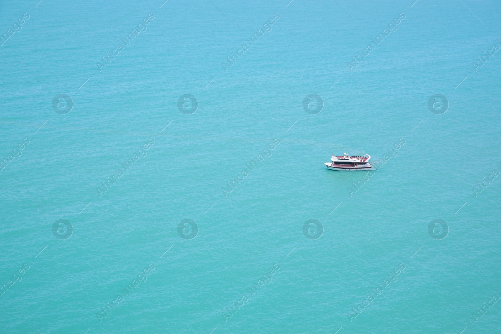 Photo of Beautiful view of boat in sea on sunny day. Space for text