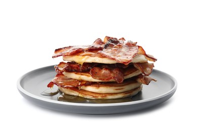 Photo of Delicious pancakes with maple syrup and fried bacon on white background