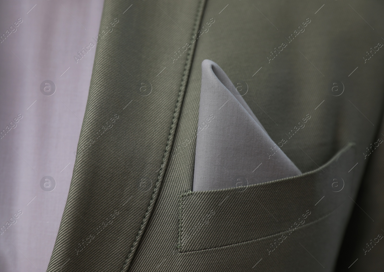 Photo of Man with handkerchief in suit pocket, closeup view