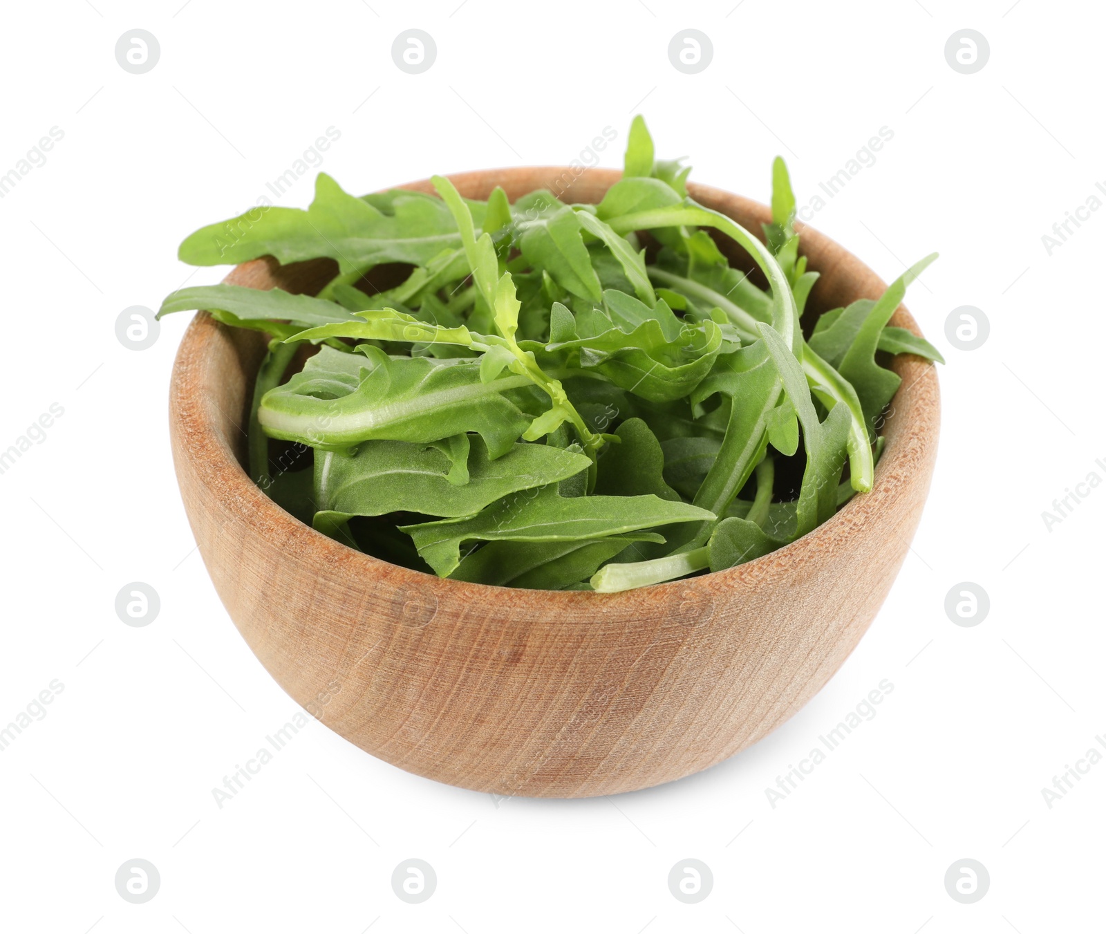 Photo of Delicious fresh arugula in wooden bowl isolated on white