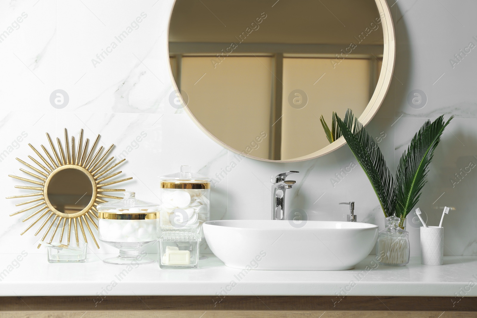 Photo of Cotton pads and other hygiene products on countertop in bathroom