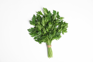 Photo of Bunch of fresh green parsley on white background, top view