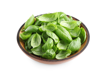 Photo of Fresh basil leaves in wooden bowl isolated on white