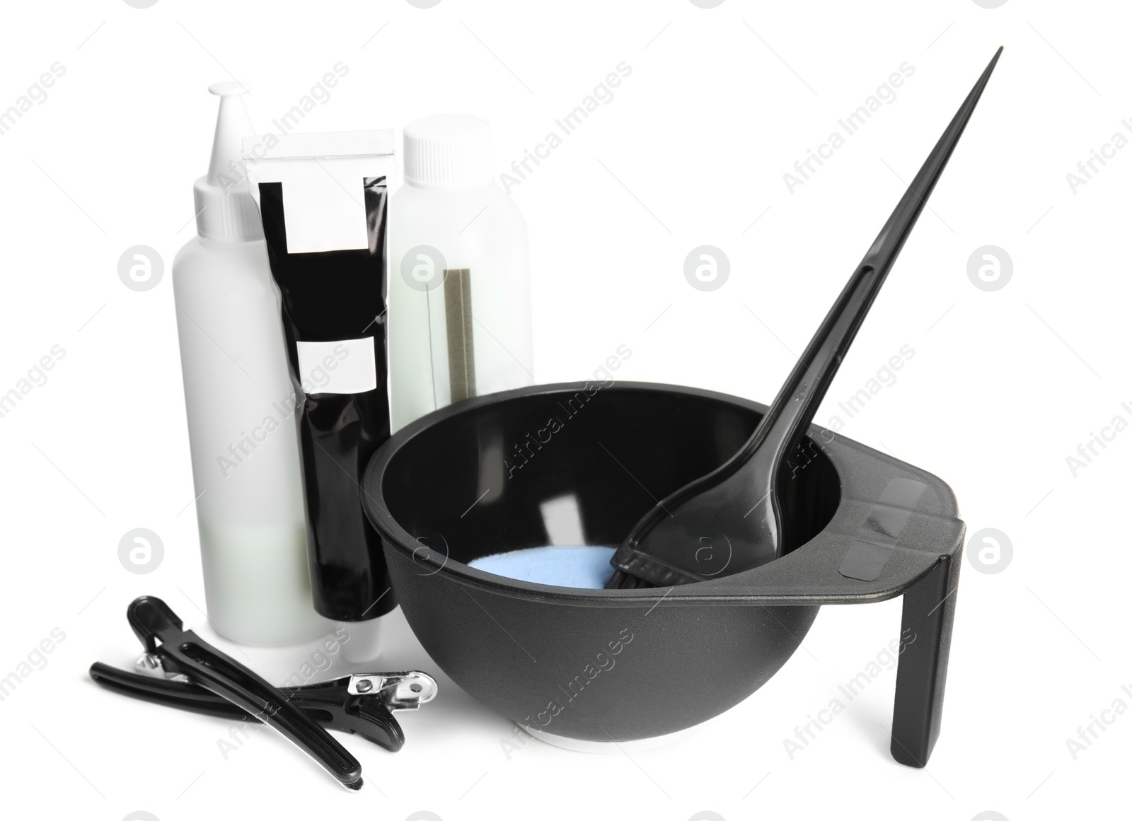 Photo of Professional tools for hair dyeing on white background