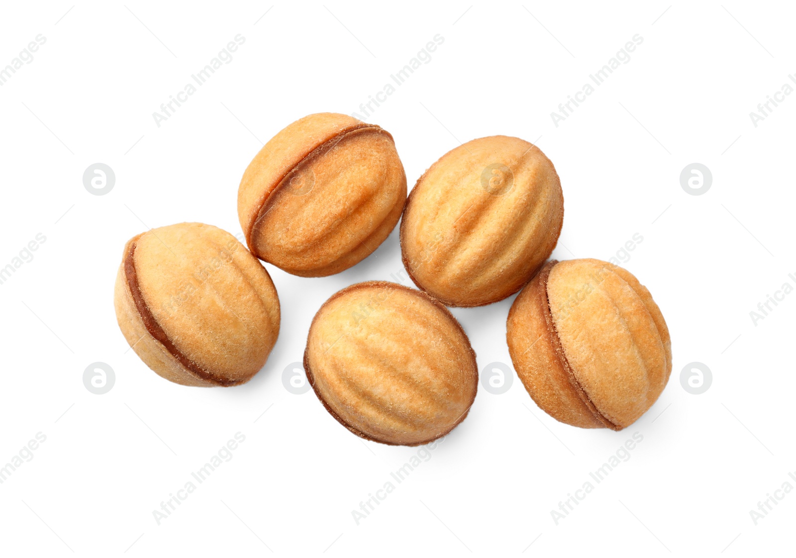 Photo of Delicious nut shaped cookies with condensed milk on white background, top view