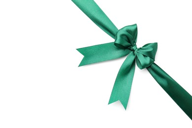 Photo of Green satin ribbon with bow isolated on white, top view