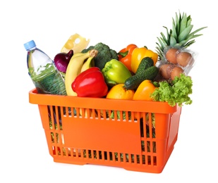 Shopping basket with grocery products on white background