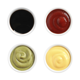 Image of Set of different delicious sauces on white background, top view